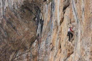 Nicola Basset on the brilliant Llagartu Verde 6a,  with a good view of the massive roof behind…